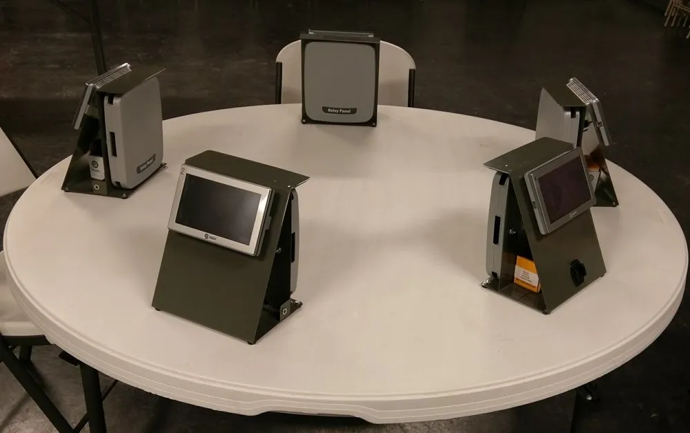 Thermostat test stations set up around a round table
